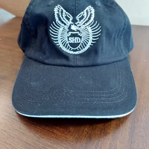 a ballcap with the Shadow Hawk Defense logo in the middle. White trim inside the brim.